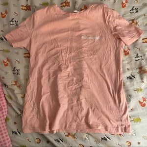 Blush pink T-shirt; embroidered slogan on the chest